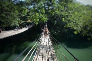 cross a bamboo bridge swim waterfall Cebu Bohol Philippines