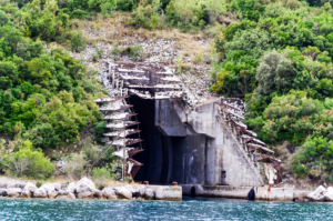 Cliff jump into an abandoned submarine bunker